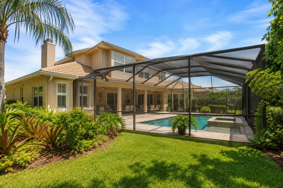 Fictional garden home with a screened pool